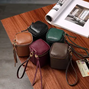 Mini vintage leather coin purses in five colors with metallic zippers and wrist straps