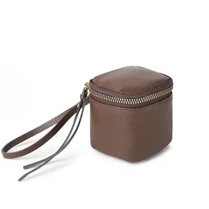Retro brown leather mini storage bag with wrist strap and zipper for travel organizing