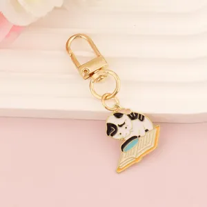 Cartoon cat reading a book metal keychain with gold plating and enamel pendant decoration