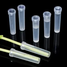 Laboratory sample tubes set with sealed caps and yellow swabs on black background