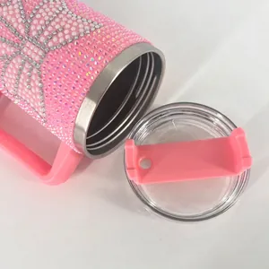Pink rhinestone studded 40oz stainless steel tumbler with handle and radial diamond pattern