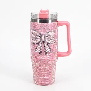 Pink rhinestone studded 40oz stainless steel tumbler with sparkling crystal bow pattern