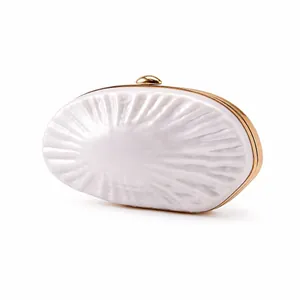 Elegant ivory shell shaped acrylic clutch bag with gold metal frame for evening weddings
