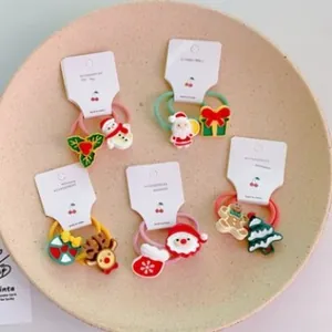 Set of 10 Christmas hair ties for kids featuring Santa, reindeer, and snowman designs