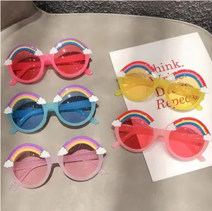 Flat lay of colorful rainbow and cloud round sunglasses for children in five vibrant colors