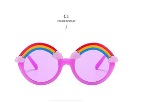 Macro shot of pink round children's sunglasses with rainbow bridge and purple lenses