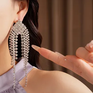 Exaggerated rhombic tassel earrings with sparkling rhinestones for a refined luxury look.