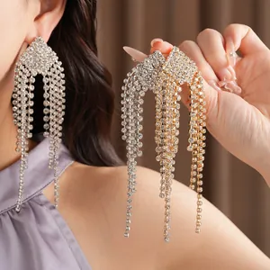 Detailed view of elegant rhombus rhinestone tassel earrings in gold and silver.