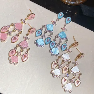 Boucles d'oreilles en argent sterling plaqué or 18 carats avec zircon et forme d'éventail