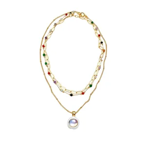 Elegant multi-layer gold link necklace with colorful stone beads and iridescent pendant