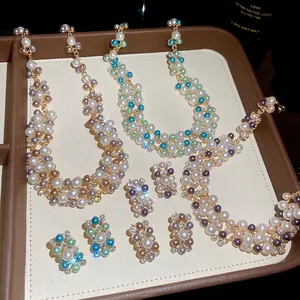 Sparkling rhinestone and pearl jewelry set with French retro design for elegant occasions.