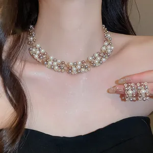 Detailed macro view of vintage multi-colored pearl and rhinestone necklace and earrings set
