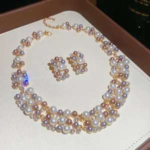 Elegant French retro pearl jewelry set including necklace and stud earrings in gold