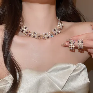 Detail of French retro pearl necklace and earrings set with sparkling rhinestones