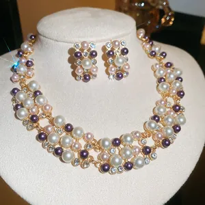 Close-up of elegant French retro pearl necklace and earring set with sparkling rhinestones