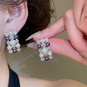 Detailed macro view of elegant French retro pearl earrings with sparkling rhinestones