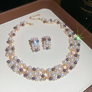 Close-up of elegant multicolor pearl and rhinestone necklace and earring jewelry set