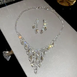 Sparkling rhinestone water drop pendant necklace and earring set with elegant detail view