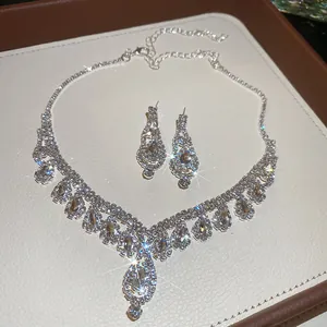 Sparkling silver-tone necklace and teardrop earring set with brilliant rhinestones