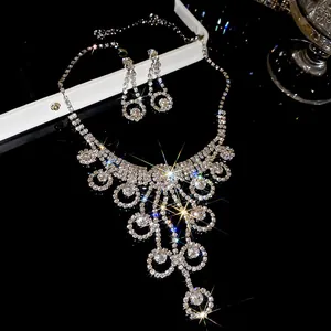 Elegant silver rhinestone water drop necklace and earring set with sparkling brilliant pendants
