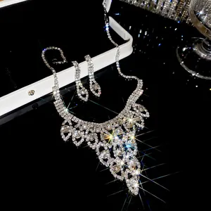 Silver-tone rhinestone water drop pendant necklace and earring set with sparkle effect