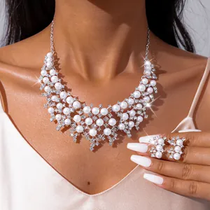 Elegant silver-toned bridal jewelry set featuring multi-layer pearls and sparkling rhinestones