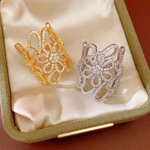 Exquisite 18K gold plated zircon hollow flower open rings presented in a luxury jewelry box