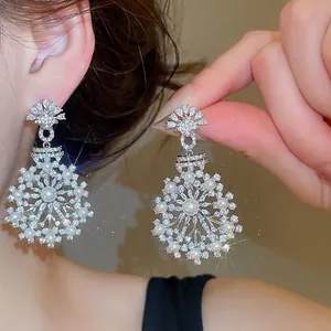 Exquisite vintage French style snowflake earrings featuring pearls and cubic zirconia