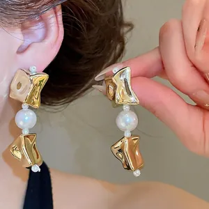 Elegant irregular gold-tone drop earrings with large white pearl for fashion women