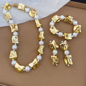 Elegant gold irregular chunky beads and white pearl jewelry set with necklace and bracelet