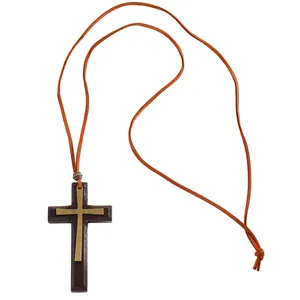 Close-up of vintage Halloween necklace featuring a double-layered wood and metal cross