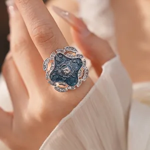 Exquisite blue enamel flower open ring with sparkling rhinestones and vintage design.
