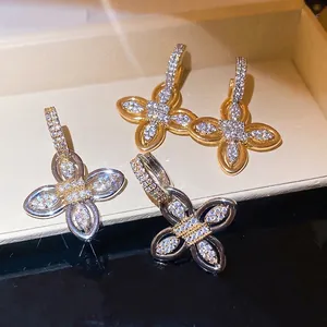 18k gold plated flower hoop earrings with sparkling cubic zirconia, luxury court style.