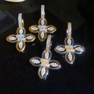 Detailed macro view of sparkling zircon flower earrings with 18k gold plating in palace style
