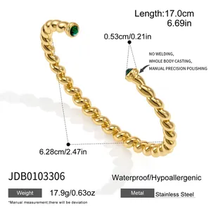 Detail view of gold twisted stainless steel cuff bracelet with product dimensions and weight