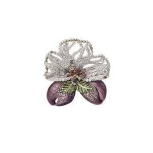 Exquisite vintage beaded crystal brooch with detailed copper wire embroidery floral design