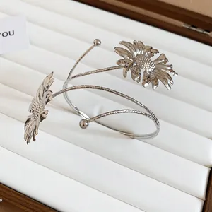 Silver oversized sunflower arm cuff with intricate petal detail for women