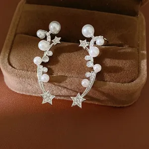 Elegant star and pearl clip-on earrings with zircon accents in a premium jewelry box