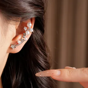 Elegant close-up shot of a star and pearl ear cuff with zirconia on an Asian model