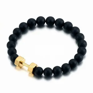 Men's matte black onyx beaded bracelet with a golden dumbbell charm for fitness fans