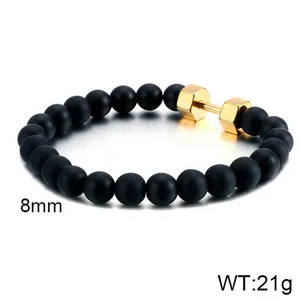 Detailed view of 8mm black matte onyx beads with a golden dumbbell charm, weighing 21g