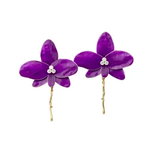 Elegant purple enamel orchid stud earrings with gold stem and sparkling crystals