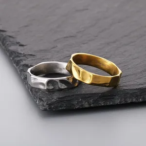 Pair of creative hammered texture titanium steel rings in gold and silver finish