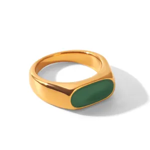 Elegant French vintage gold stainless steel ring featuring a vibrant green enamel inlay