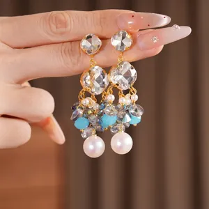 Handmade silver needle earrings with crystal and pearl tassels in a vintage luxury style