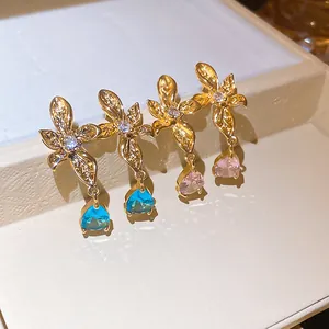 Elegant 18k gold plated flower stud earrings with blue and pink teardrop zircon dangles.