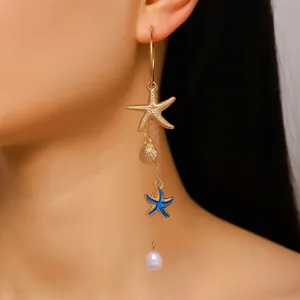 Close-up detail of Bohemian ocean-themed long tassel earring featuring starfish and shell