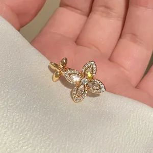 Elegant gold floral star adjustable ring with shimmering zircons for a sophisticated look