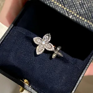 Exquisite silver star flower open ring with zircons presented in a navy jewelry box