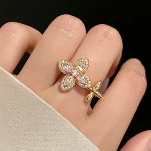 Elegant gold-toned zircon star flower open ring for women with marquise-cut stones.